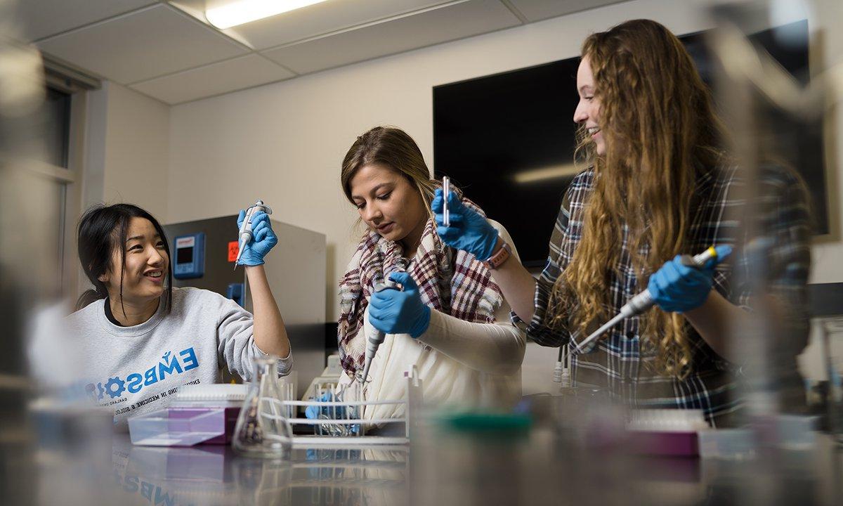 Three women in a lab. 