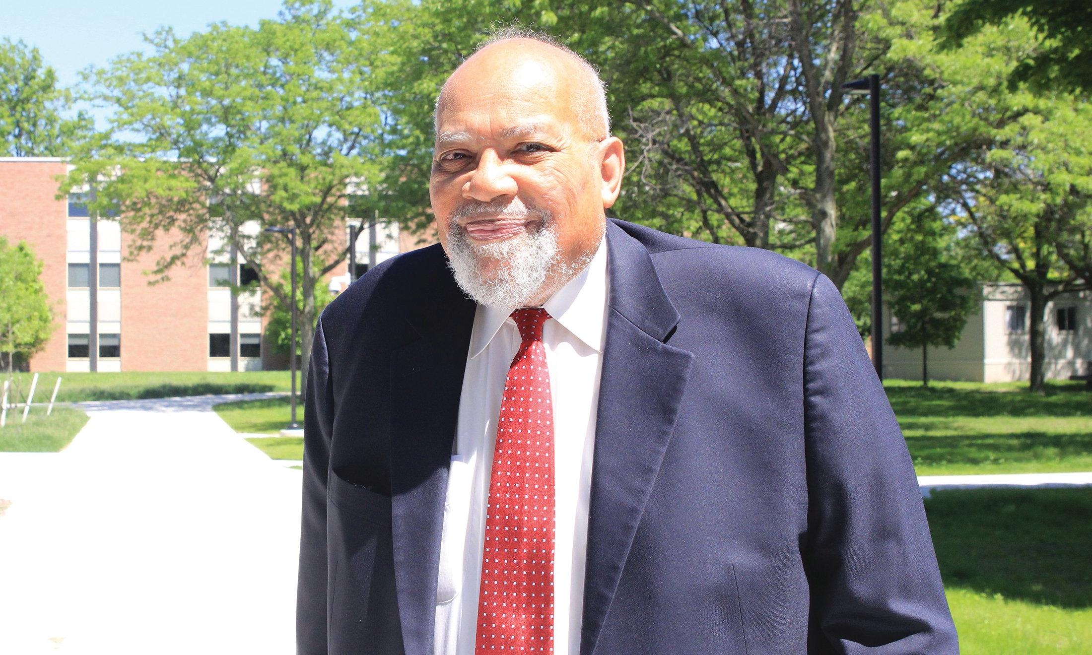 A man smiling outside.